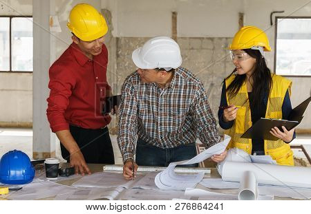 Team Of Business People In Group, Architect And Engeneer On Construciton Site Check Documents And Bu