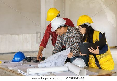 Team Of Business People In Group, Architect And Engeneer On Construciton Site Check Documents And Bu