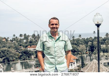 Young Man In Taman Ujung Water Palace, Bali Island, Indonesia.