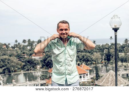 Young Man In Taman Ujung Water Palace, Bali Island, Indonesia.