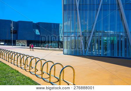 Barcelona, Spain - September 30, 2012: People Near The Basement  Of The Telefonica Tower