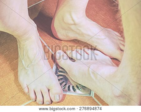 Feet Of Girlfriend  And Boyfriend Together In Tilled Shower Stall. Modern Design Of Bathroom.
