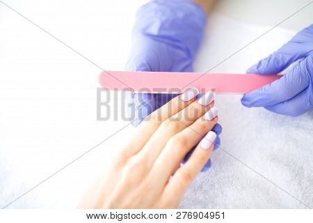 Spa Manicure. French Manicure At Spa Salon. Woman Hands In A Nail Salon Receiving A Manicure Procedu