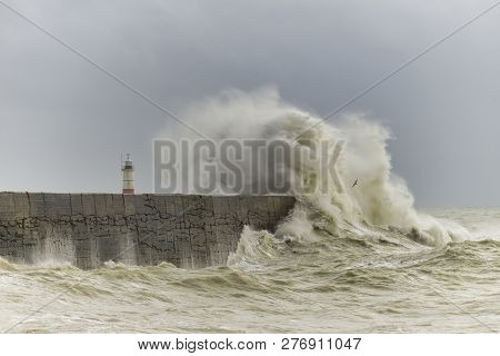 Stunning Waves Crashing Over Harbor Wall During Windy Storm At Newhaven On English Coast