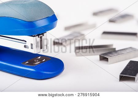 Office Stapler With Staples On A White Background.