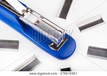 Office Stapler With Staples On A White Background.
