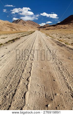 Pamir Highway Or Pamirskij Trakt With Biker, There Is One Of The Best Cycling Road On The World. Unp
