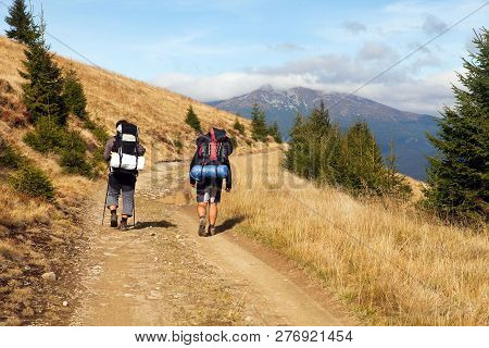 Mount Hoverla Or Goverla With Two Tourists, Ukraine Karpathian Mountains