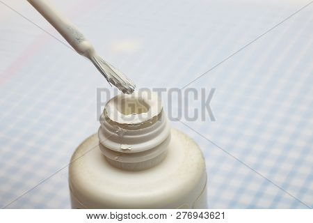 Brush To Correct Errors On A Sheet Of Notebook