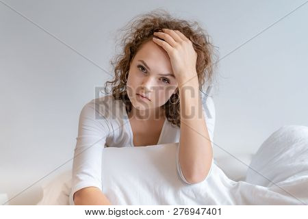 The Girl Was Sitting In The Bed. She Was Stressed.