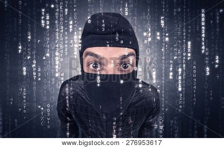 Burglar in action with encoded concept and his tools in his hand. 