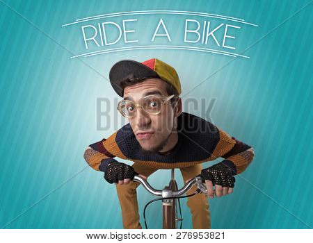 Kooky young guy on a bike with cyclist keywording and streaky background