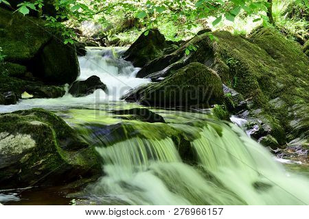 Long Exposure Of A Waterfall At Watersmeet In Devon