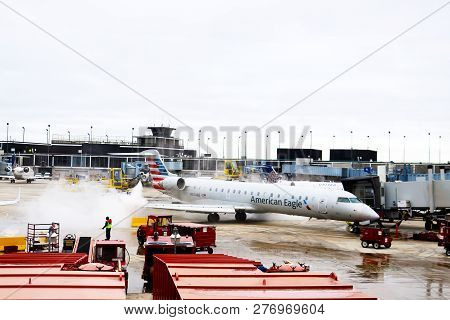 De-icing An American Eagle Airplance At Ohare Airport Chicago Illiniois Usa 1 -12 - 2018