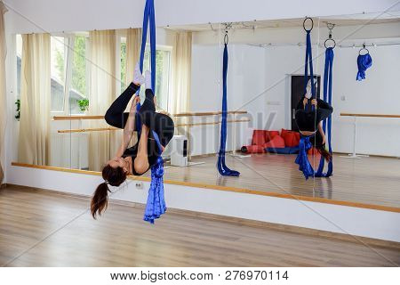 Fitness Rope Climb Cxercise In Gym. Young Woman Gymnast On Rope