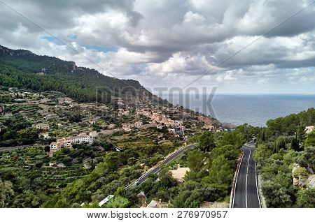 Aerial View Coastal Small Hillside Banyalbufar Town On West Coast Of Mallorca. Surrounded By Tramunt