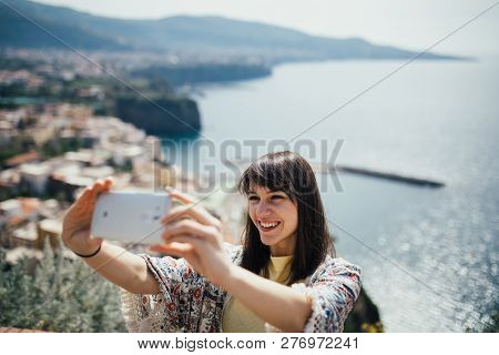 Happy Woman Traveler Smiling At Italian Coast View.woman Traveling To European South Coast.enoying S