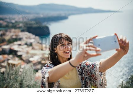 Happy Woman Traveler Smiling At Italian Coast View.woman Traveling To European South Coast.enoying S