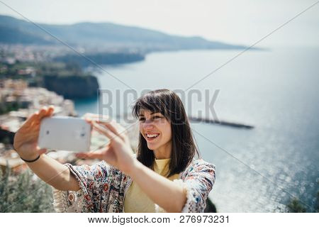 Happy Woman Traveler Smiling At Italian Coast View.woman Traveling To European South Coast.enoying S