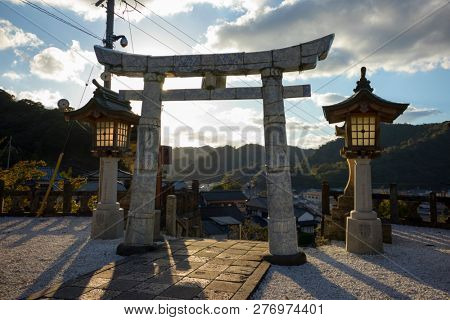 Arita, Japan - October 30, 2018: Unique Torii gate of the Tozan shrine made out of Arita porcelain at dusk
