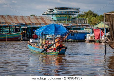 chong khneas, cambodia - november 29, 2018: chong khneas is a floating village on the tonle sap. here people live in traditional relationships on houseboats.