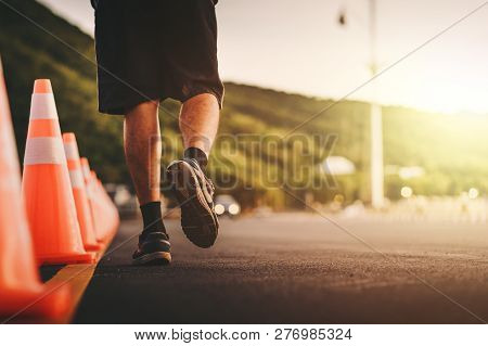 Man Running On The Road With Sunset.