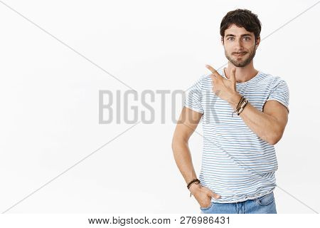 Skillful Male Entrepreneur Showing Product To Potential Customer Standing Confident And Relaxed Poin