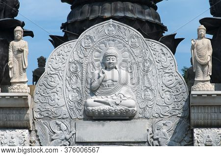 Various Buddha Statues Atop The Gate At The Entrance To Huayan Temple In Qingdao China Laoshan Distr