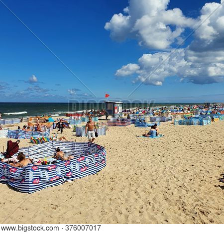 Wladyslawowo, Poland - July 12, 2020: People Are Resting On The Beach On A Sunny Day In Wladyslawowo