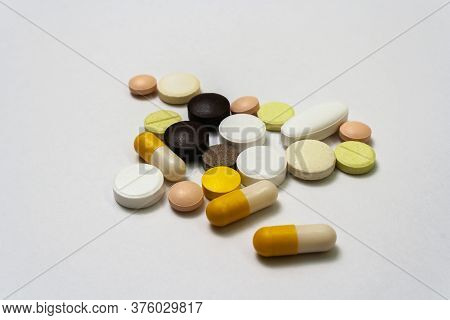 Bunch Colorful Pills And Capsules On A White Background Close Up, Macroshot Tablets, Isolated. Pande