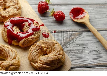 A Homemade Cruller Donuts With Strawberry Jam