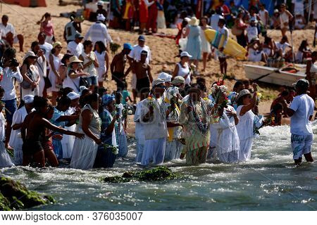 Salvador, Bahia / Brazil - February 2, 2015: Supporters Of Candomble Are Seen On The Rio Vermelho Be