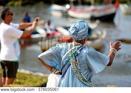 Salvador, Bahia / Brazil - February 2, 2015: Supporters Of Candomble Are Seen On The Rio Vermelho Be