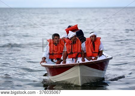 Salvador, Bahia / Brazil - February 2, 2015: Supporters Of Candomble Are Seen On The Rio Vermelho Be