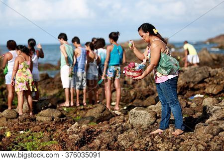 Salvador, Bahia / Brazil - February 2, 2015: Supporters Of Candomble Are Seen On The Rio Vermelho Be