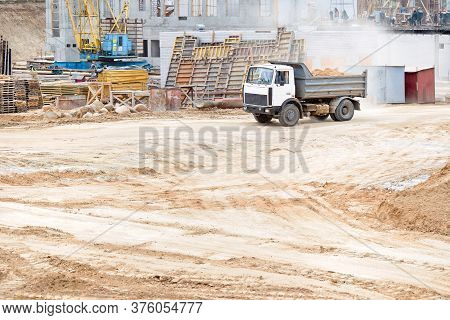 Multi-ton Dump Heavy Mining Truck Loaded During Removal Of Construction Soil From Construction Site.
