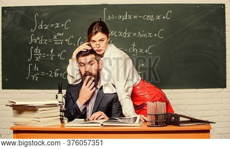 School And Sexual Behavior. Confused Teacher Under Domination Of Sensual Student. Man Under Woman Do