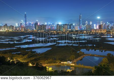 Skyline Of Shenzhen City, China At Twilight. Viewed From Hong Kong Border