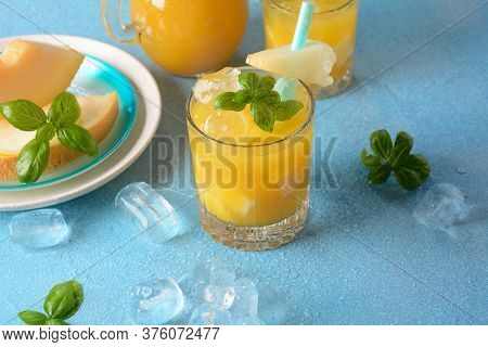 Refreshing Drinks And Citrus Juices  With Ice Cubes, Mint And Melon. Summer Concept