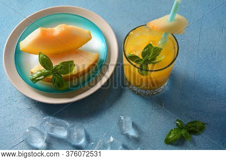 Refreshing Drinks And Citrus Juices  With Ice Cubes, Mint And Melon. Summer Concept