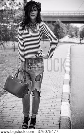 Young Woman In Modern French Style, Wear In Jeans And Jemper, Hat Beret. Casual Fashionable Style Fo