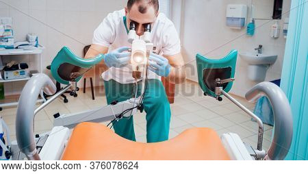 Gynecologist Working With Colposcope In Clinic. Medical