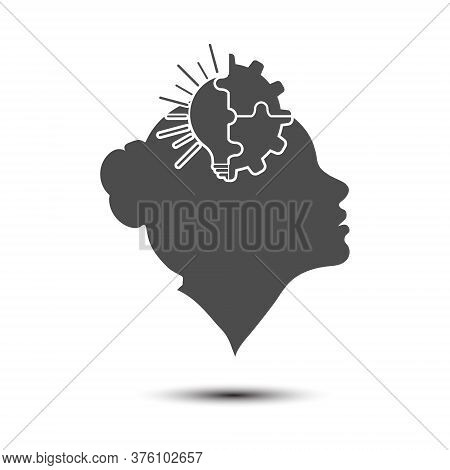Light Bulb And Gear Combined With The Silhouette Of A Female Head. A Metaphor For The Realization Of