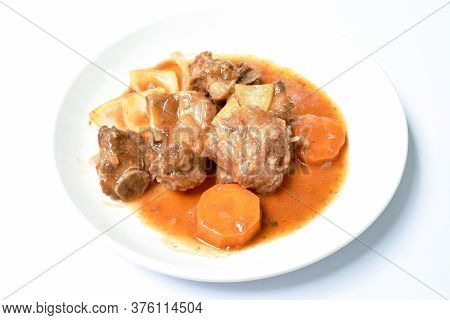 Fried Pork Bone With Slice Carrot And Onion With Swet And Sour Sauce On Plate