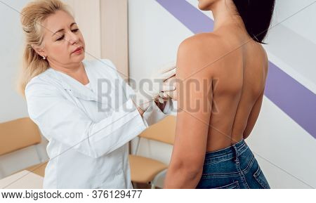 Doctor Get Examining Breast Of Young Woman. Consultation With Gynecologist.