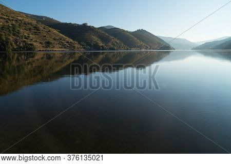 Scenic view of the Douro Valley and river with terraced vineyards near the village of Tua, Portugal