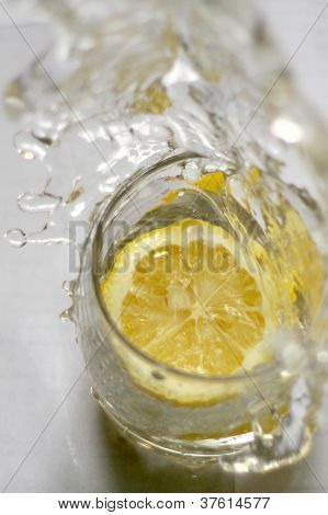 water splash with lemon in a glass