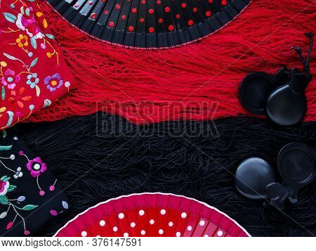 Sochi, Russia December 10, 2019: Black Castanets And Open Fans Lie On A Spanish Shawl. Space For Tex