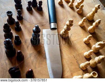 Chess Pieces And Knife