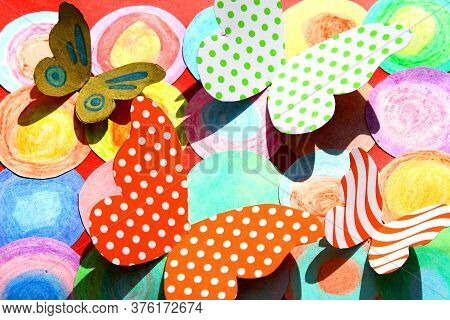 Crafts That Represent Cardboard Butterflies On Colored Flowers. It Is A Representation Of Spring And